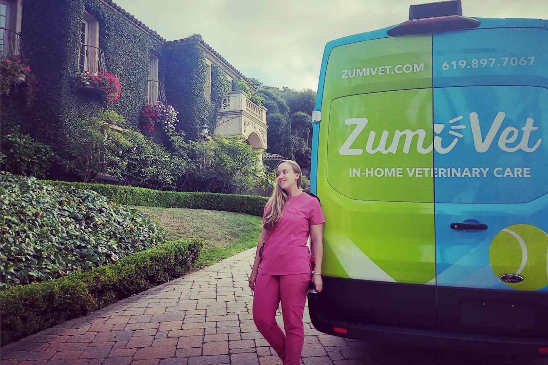 vet standing by her mobile vet van
