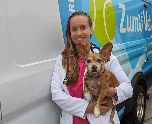 Vet standing by her mobile clinic