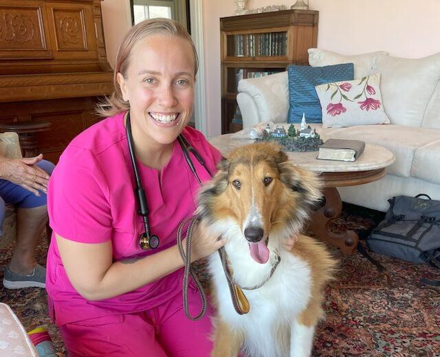 Doctor with a dog doing a home visit for rehab